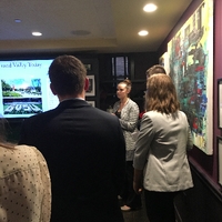 A few Alumni listening to speaker